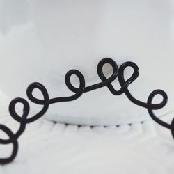 Close-up of text on metal fence