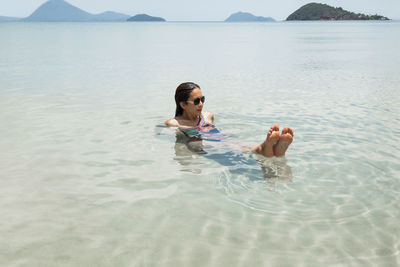 Portrait of  woman swimming in sea