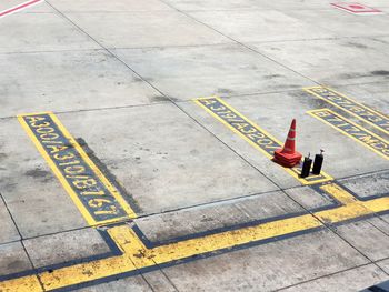 High angle view of traffic cone on number at parking lot