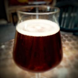 Close-up of beer glass on table