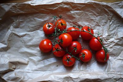 High angle view of cherry tomatoes on paper bag