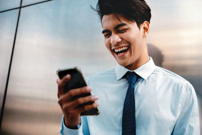 Young man using mobile phone