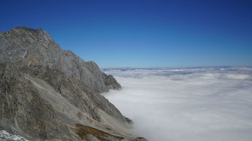 Scenic view of mountains against clear blue sky