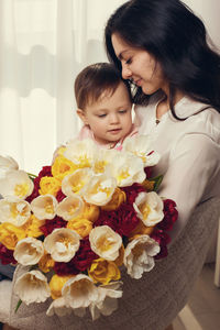 High angle view of girl with bouquet