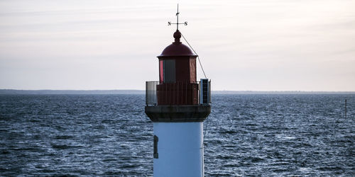 Sailboat in sea against sky