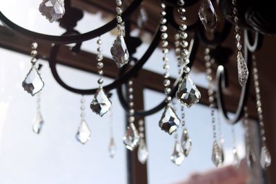 Low angle view of crystal decorations hanging at home