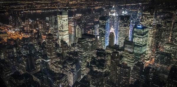 Aerial view of illuminated cityscape at night