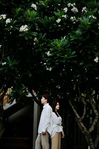 Rear view of bride holding bouquet
