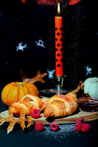 Cropped hand of man holding food on table