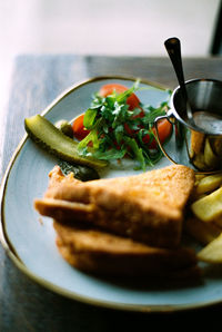 Close-up of breakfast served in plate on table