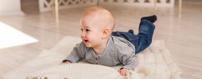 Boy lying on bed at home