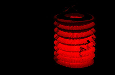 Close-up of light bulb over black background