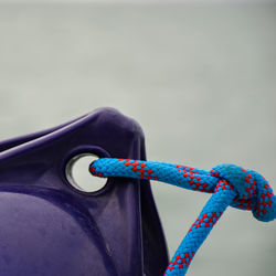 Close-up of multi colored rope against blue sky