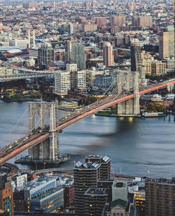 High angle view of bridge over river and buildings in city