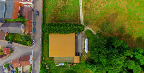 High angle view of road amidst trees in city