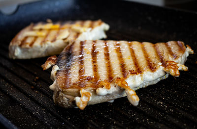 High angle view of meat on barbecue grill