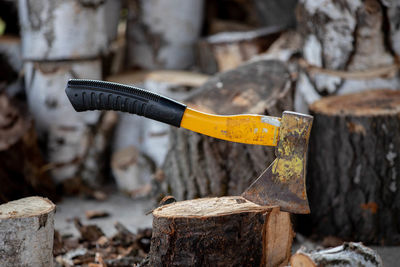 Cropped hand of man working on wood