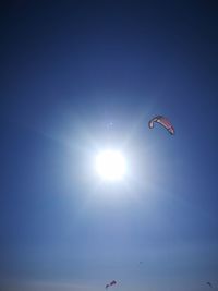 Low angle view of kite flying in sky