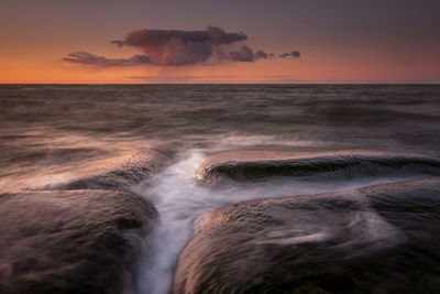 Scenic view of sea against sky during sunset