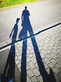 Shadow of people on street