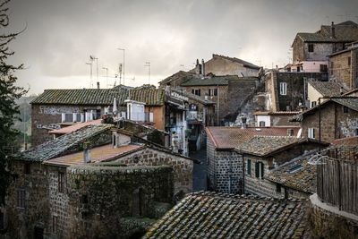 High angle view of buildings in city against sky