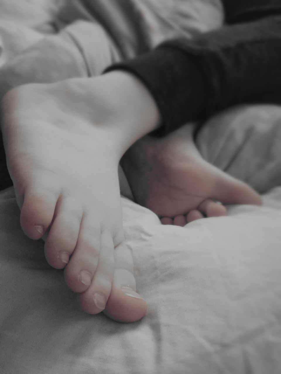LOW SECTION OF BABY FEET