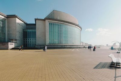 People in front of modern building