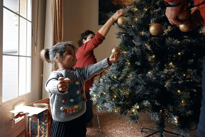 People at christmas tree