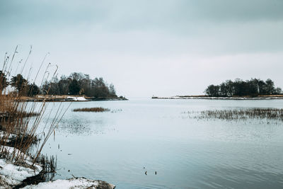 Scenic view of frozen lake against sky