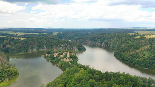 High angle view of river amidst trees against sky