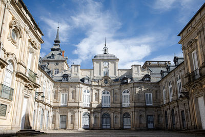 Low angle view of historic building against cloudy sky