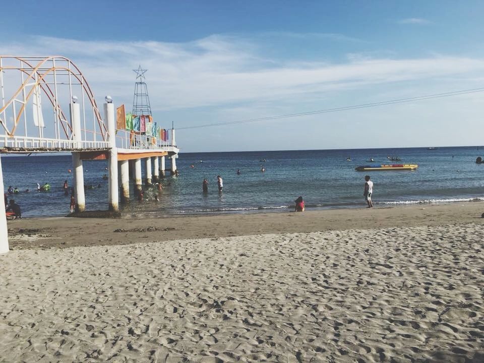 beach, land, sea, water, sky, horizon over water, horizon, sand, amusement park, day, nature, incidental people, scenics - nature, architecture, amusement park ride, trip, pier, built structure, vacations, outdoors