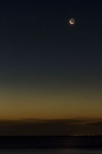 Scenic view of sea against sky at night