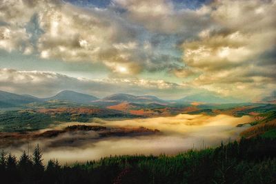 Scenic view of landscape against cloudy sky