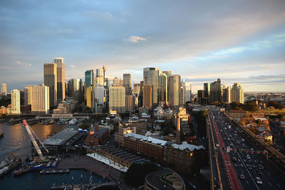 Cityscape against cloudy sky