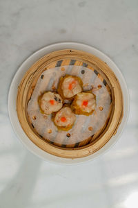 High angle view of pastries in bowl on table