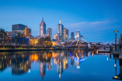 Reflection of illuminated buildings in water