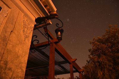 Low angle view of built structure against sky at night