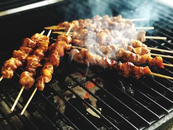 High angle view of meat on barbecue grill