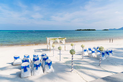 Scenic view of beach against blue sky