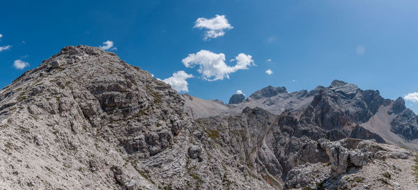 Panoramic view of rocky mountains against sky