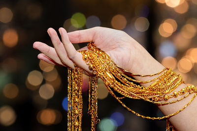 Close-up of human hand against blurred background