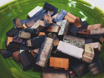 Close-up of alphabets on letterpress in plate