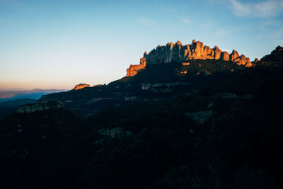 Scenic view of rock formations against sky