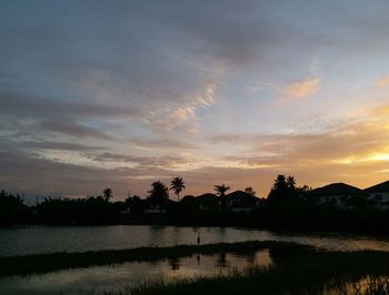 Scenic view of lake against sky during sunset