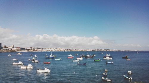 Boats moored in sea