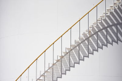 Metallic staircase against white wall