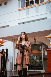 Young woman standing in city