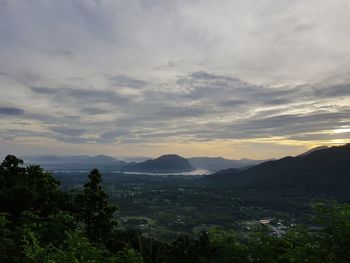 Scenic view of mountains against sky at sunset