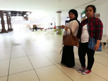 Couple standing in corridor